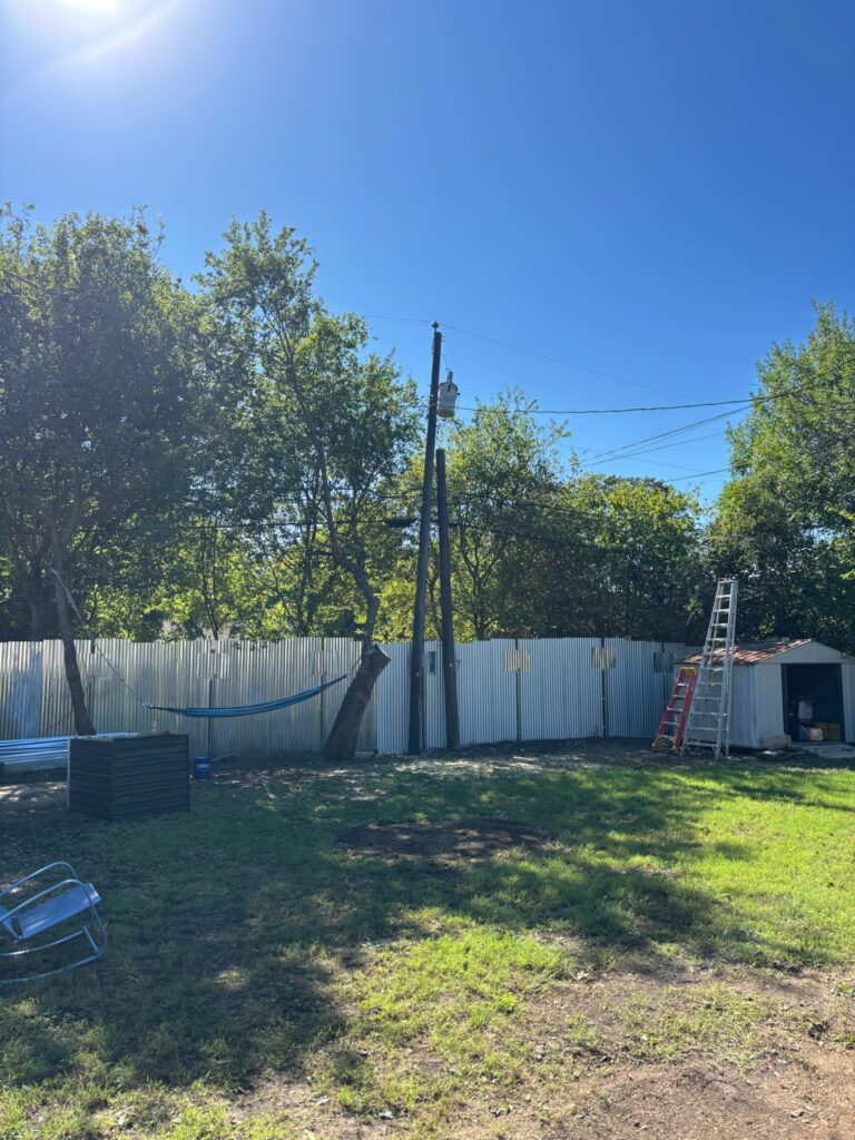 Backyard after a tree was removed and the area cleaned up, Wise Oak Tree Service tree removal in Central Texas